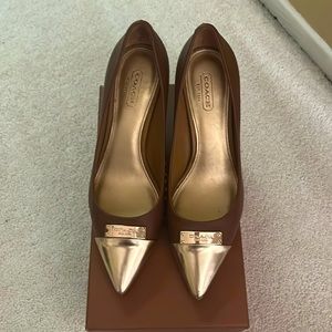 Coach brown heels with gold toe.